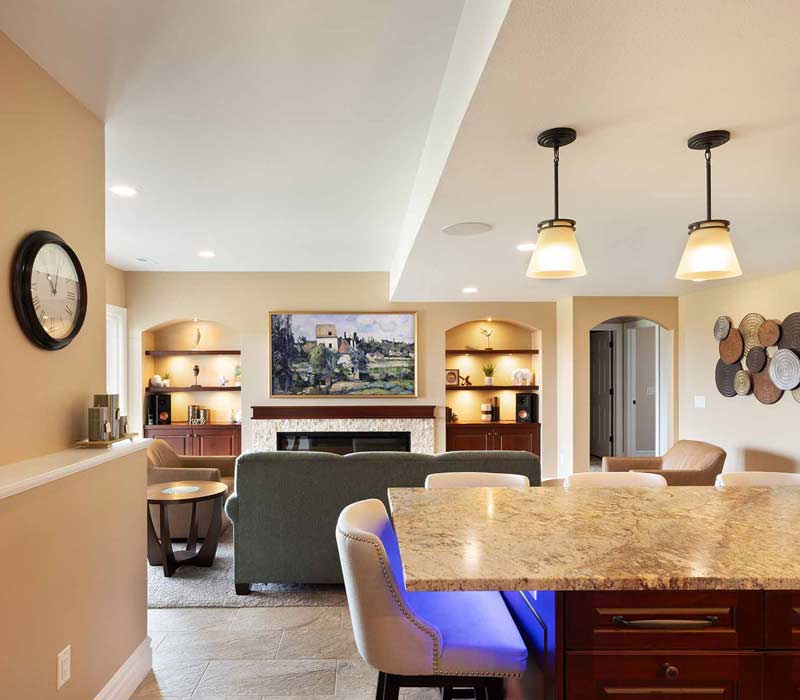 We transformed this basement into a luxurious retreat complete with a theater room, family room, bar, and game room. The remodel employs a traditional style and elevates everyday living.