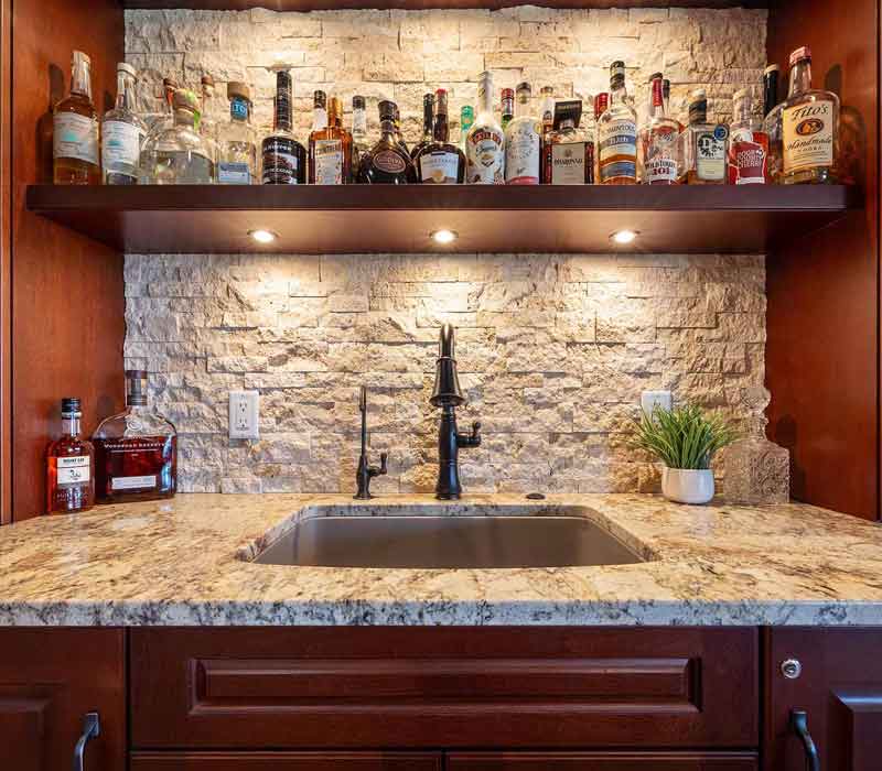 We transformed this basement into a luxurious retreat complete with a theater room, family room, bar, and game room. The remodel employs a traditional style and elevates everyday living.