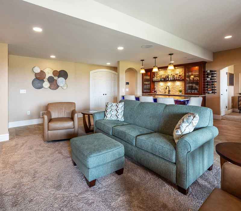 We transformed this basement into a luxurious retreat complete with a theater room, family room, bar, and game room. The remodel employs a traditional style and elevates everyday living.