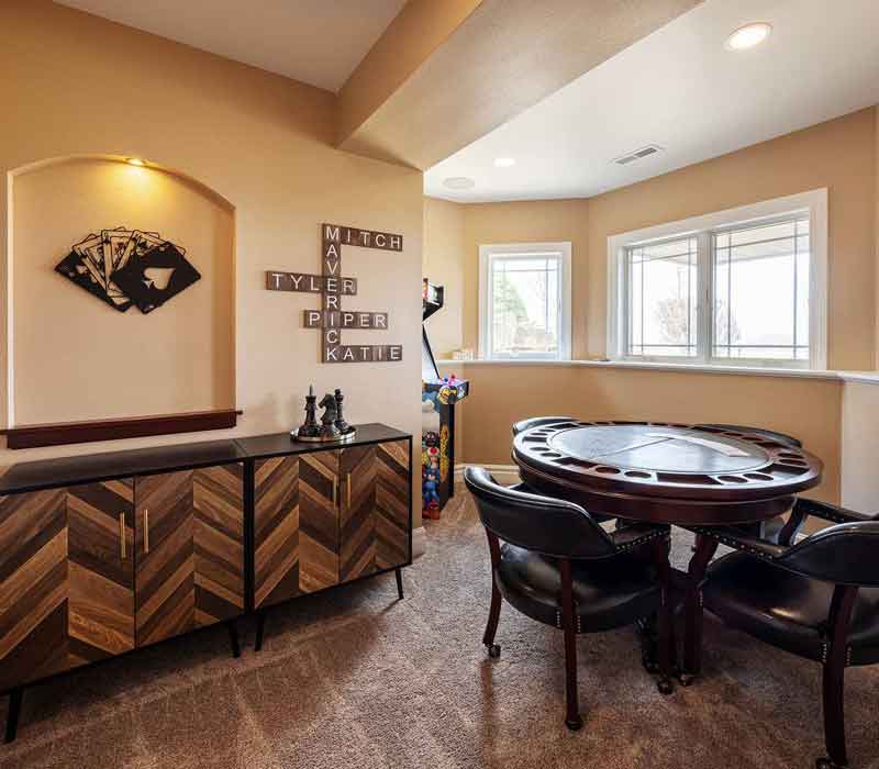 We transformed this basement into a luxurious retreat complete with a theater room, family room, bar, and game room. The remodel employs a traditional style and elevates everyday living.