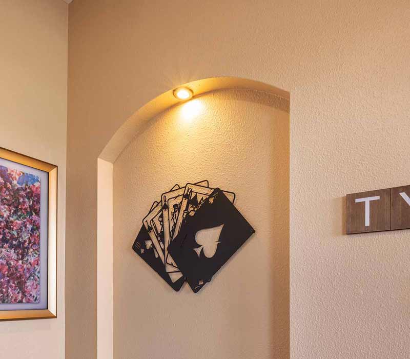 We transformed this basement into a luxurious retreat complete with a theater room, family room, bar, and game room. The remodel employs a traditional style and elevates everyday living.