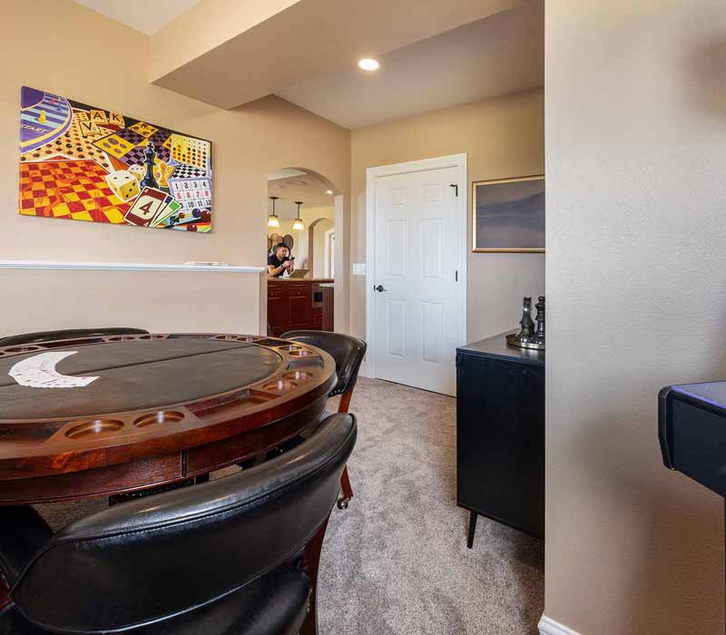 We transformed this basement into a luxurious retreat complete with a theater room, family room, bar, and game room. The remodel employs a traditional style and elevates everyday living.