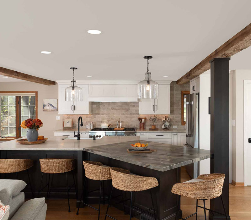 This full kitchen reconfiguration and primary suite remodel reimagines lakeside living with a blend of relaxed comfort and understated indulgence. 
