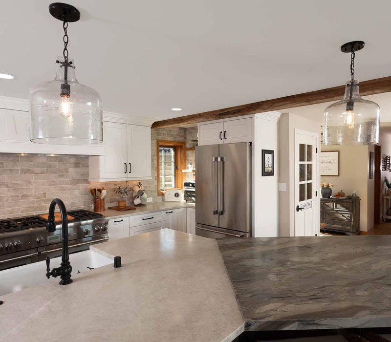 This full kitchen reconfiguration and primary suite remodel reimagines lakeside living with a blend of relaxed comfort and understated indulgence. 