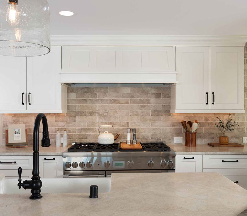 This full kitchen reconfiguration and primary suite remodel reimagines lakeside living with a blend of relaxed comfort and understated indulgence. 