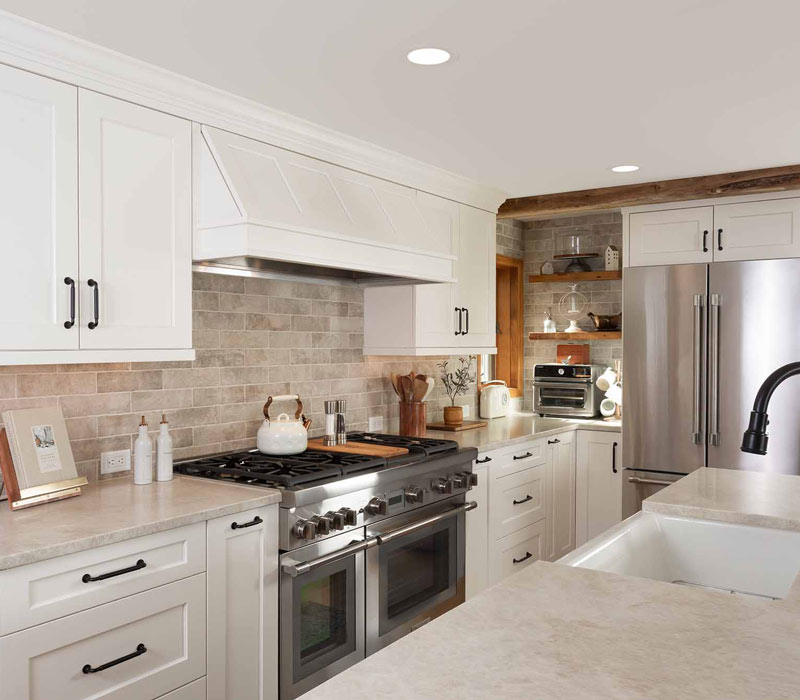 This full kitchen reconfiguration and primary suite remodel reimagines lakeside living with a blend of relaxed comfort and understated indulgence. 