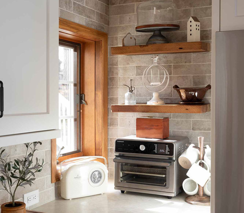 This full kitchen reconfiguration and primary suite remodel reimagines lakeside living with a blend of relaxed comfort and understated indulgence. 