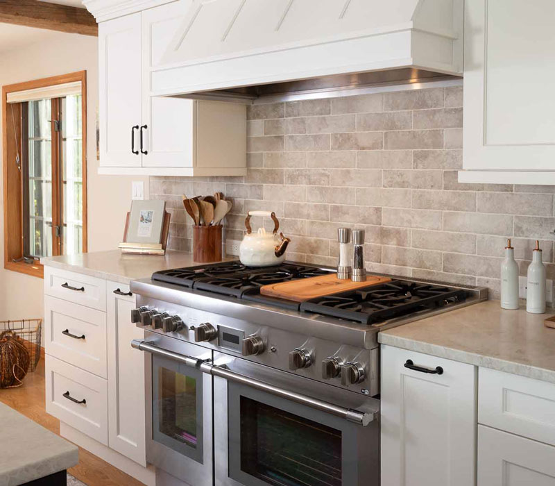 This full kitchen reconfiguration and primary suite remodel reimagines lakeside living with a blend of relaxed comfort and understated indulgence. 