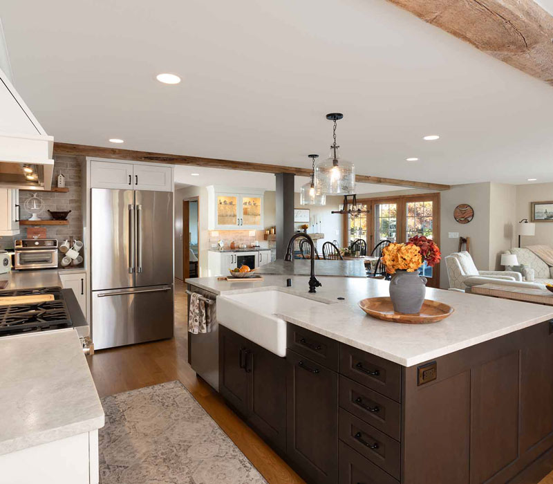 This full kitchen reconfiguration and primary suite remodel reimagines lakeside living with a blend of relaxed comfort and understated indulgence. 