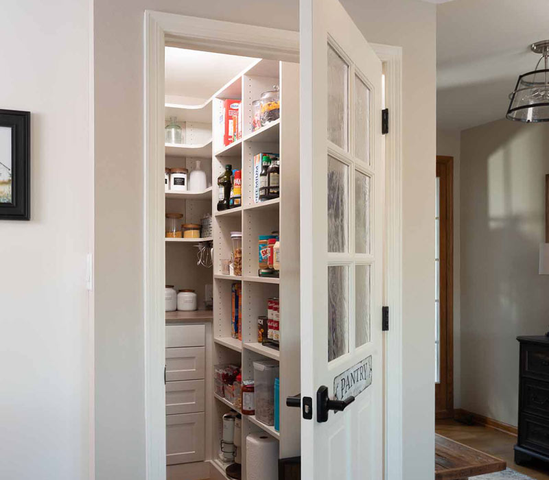 This full kitchen reconfiguration and primary suite remodel reimagines lakeside living with a blend of relaxed comfort and understated indulgence. 