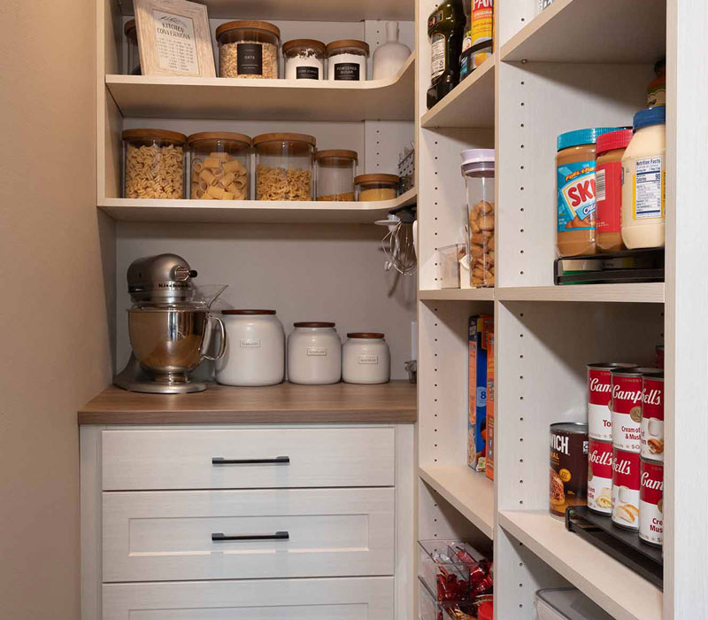 This full kitchen reconfiguration and primary suite remodel reimagines lakeside living with a blend of relaxed comfort and understated indulgence. 