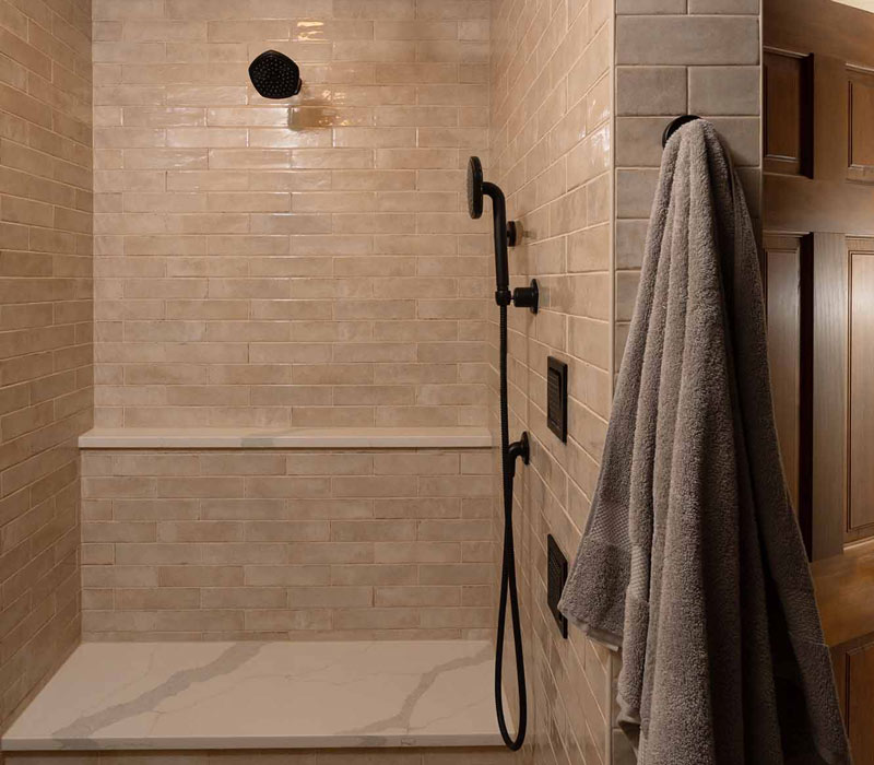 This full kitchen reconfiguration and primary suite remodel reimagines lakeside living with a blend of relaxed comfort and understated indulgence. 