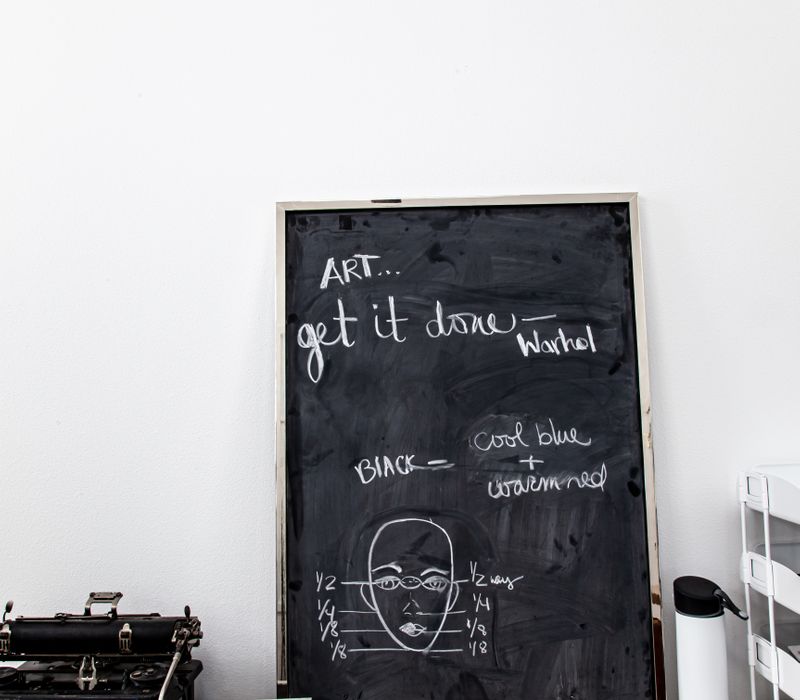 This remodeled split-level home features retro touches in an open contemporary space, and includes a craft room, central brick fireplace, exposed wood ceiling beams, and an open riser staircase. 