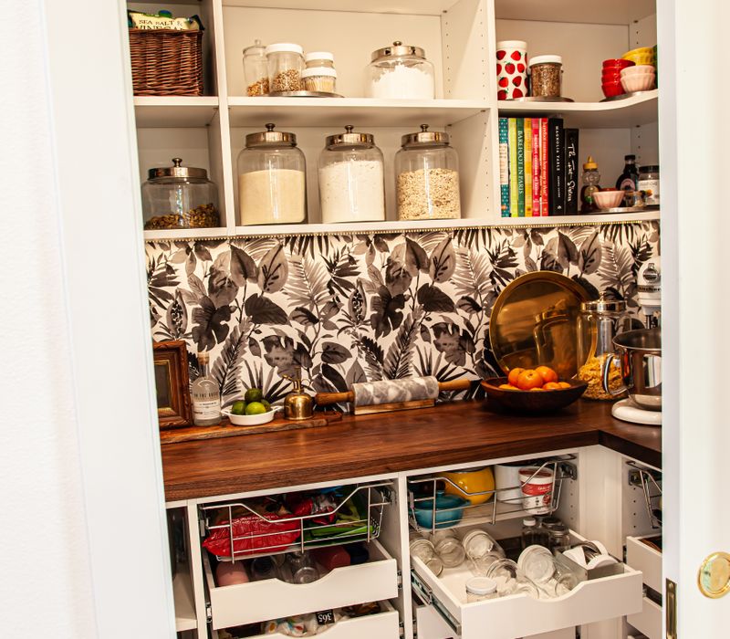 This remodeled split-level home features retro touches in an open contemporary space, and includes a craft room, central brick fireplace, exposed wood ceiling beams, and an open riser staircase. 