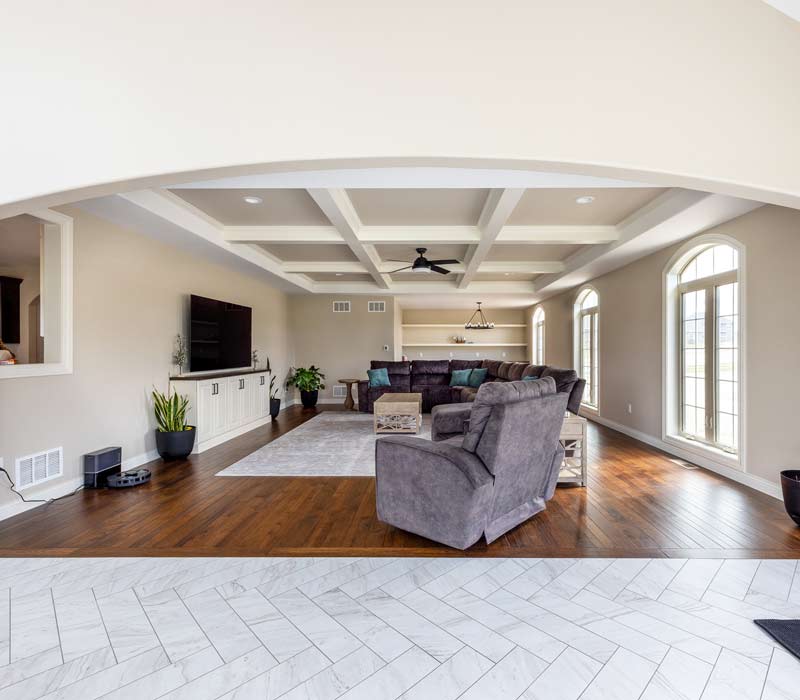 With a refined transitional style and a palette of timeless neutrals, this home addition harmonizes perfectly with the house’s original character. The project added a flex space, new family room, children's nook, and luxe laundry room.