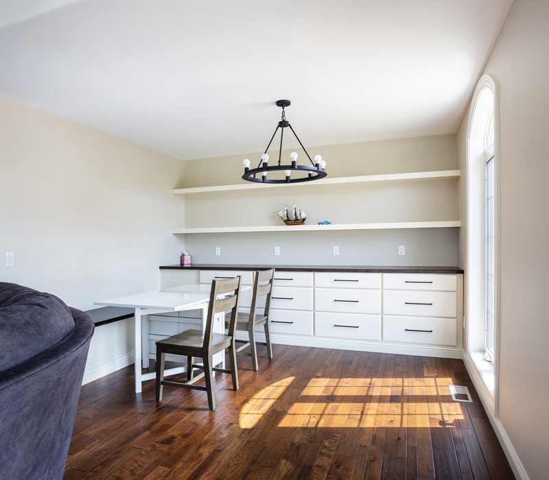 With a refined transitional style and a palette of timeless neutrals, this home addition harmonizes perfectly with the house’s original character. The project added a flex space, new family room, children's nook, and luxe laundry room.