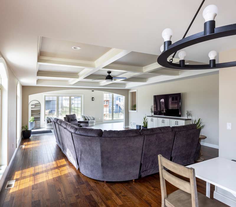 With a refined transitional style and a palette of timeless neutrals, this home addition harmonizes perfectly with the house’s original character. The project added a flex space, new family room, children's nook, and luxe laundry room.