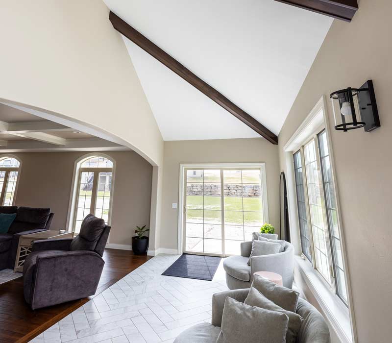 With a refined transitional style and a palette of timeless neutrals, this home addition harmonizes perfectly with the house’s original character. The project added a flex space, new family room, children's nook, and luxe laundry room.