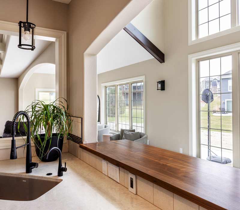 With a refined transitional style and a palette of timeless neutrals, this home addition harmonizes perfectly with the house’s original character. The project added a flex space, new family room, children's nook, and luxe laundry room.