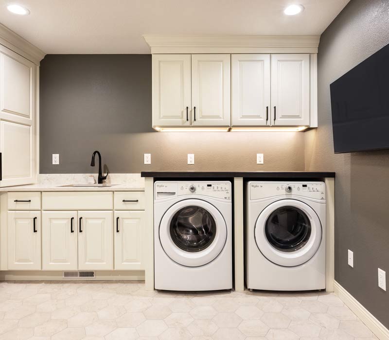 With a refined transitional style and a palette of timeless neutrals, this home addition harmonizes perfectly with the house’s original character. The project added a flex space, new family room, children's nook, and luxe laundry room.