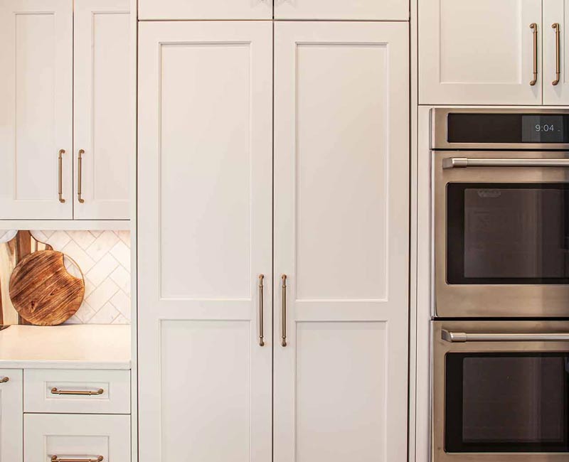 Concealed by what looks like tall cabinet doors, this full walk-in pantry frees up space in the kitchen and provides convenient storage for dry goods, perishables, and cookware alike.