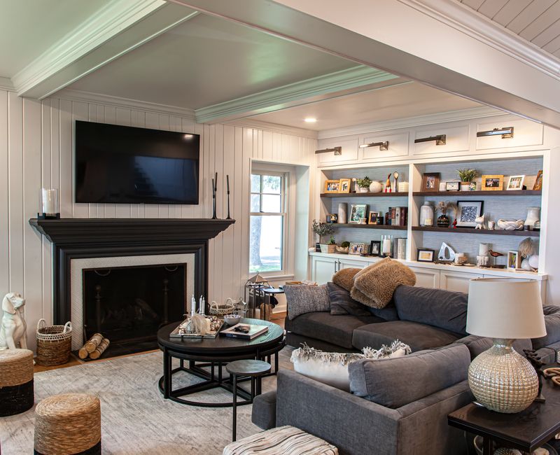Subway tiles, white cabinetry, and coffered and beadboard ceilings add a sophisticated touch to this comfortable classic home. 